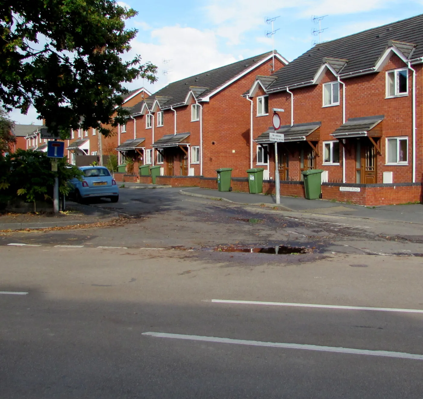 Green recycling bins out on Pinsley Road, Leominster. Herefordshire collects recycling and rubbish on alternate weeks.